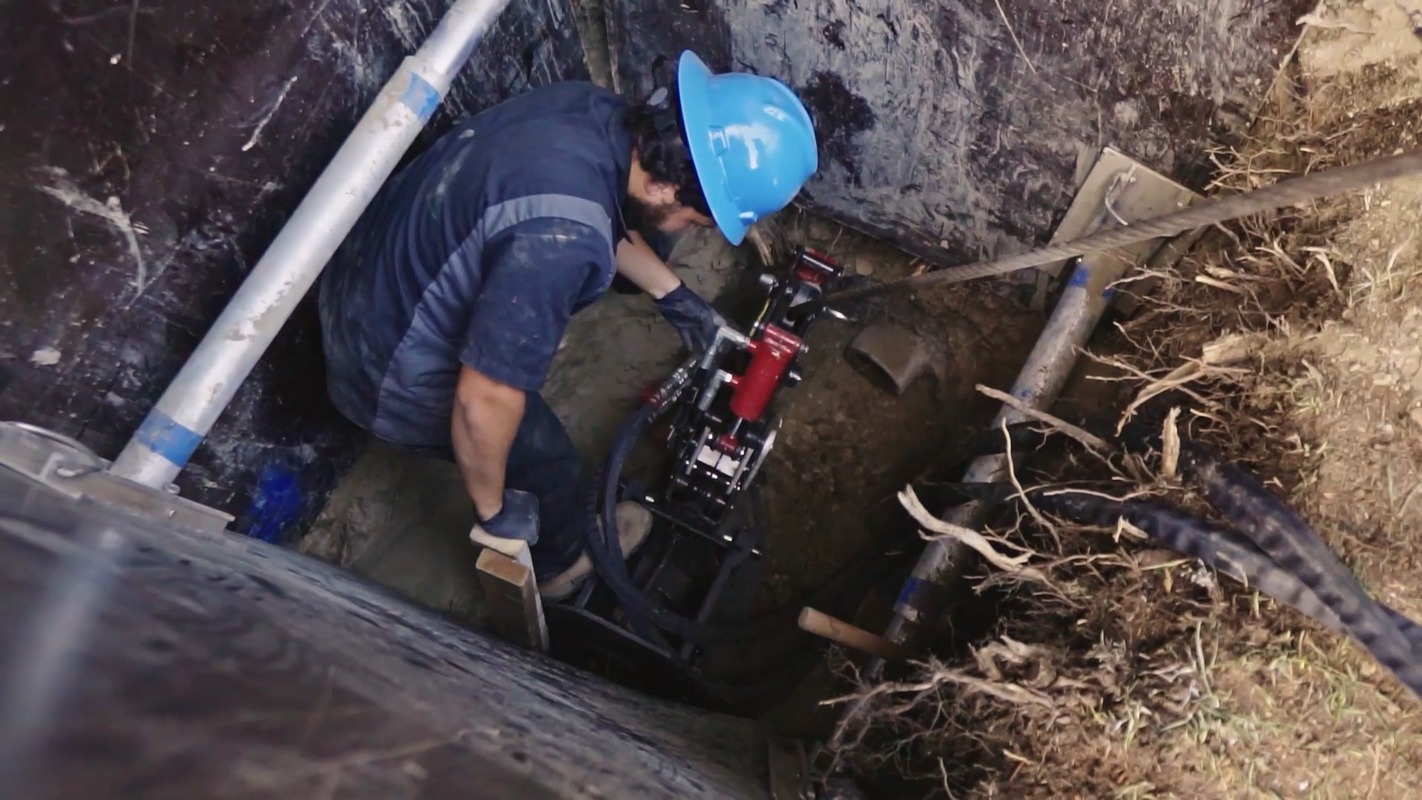 Professional sewer line inspection showing damaged piping.