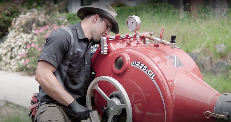 Professional sewer cleaning equipment removing sewer line buildup.