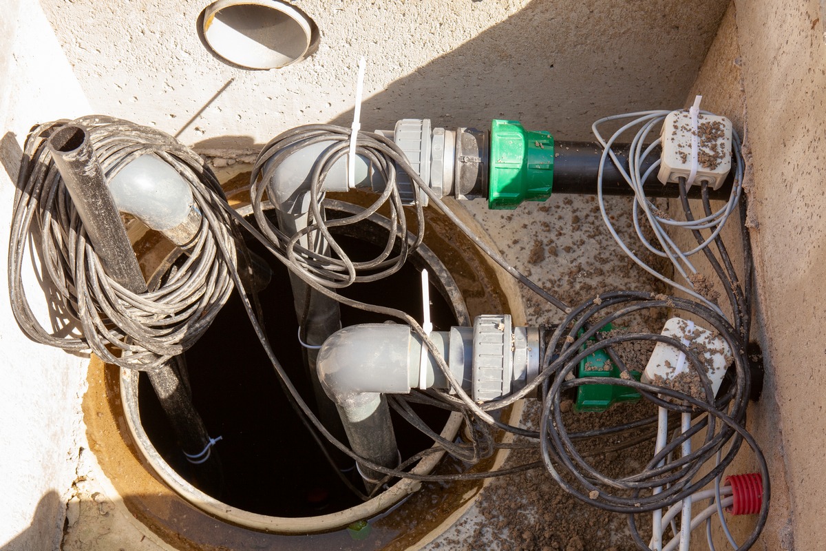 New sump pump installed inside a sump basin.