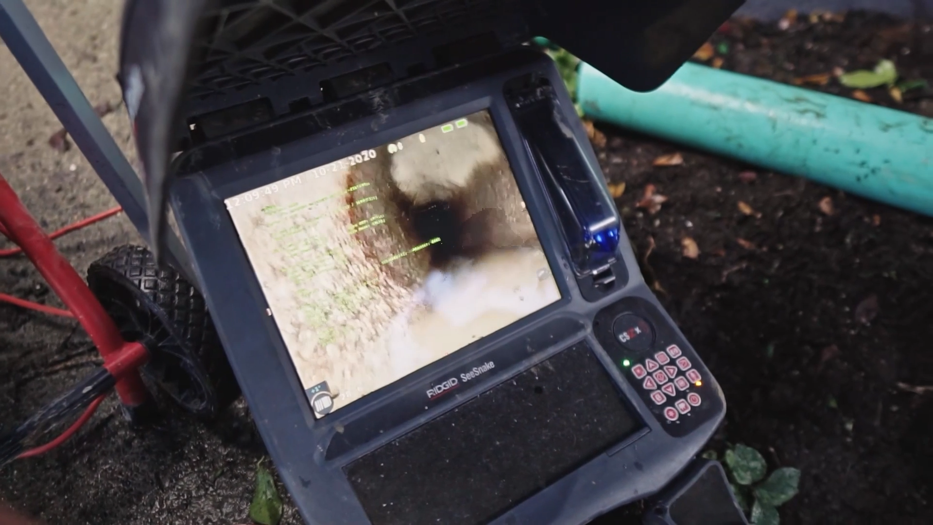 Licensed plumber performing a sewer camera inspection