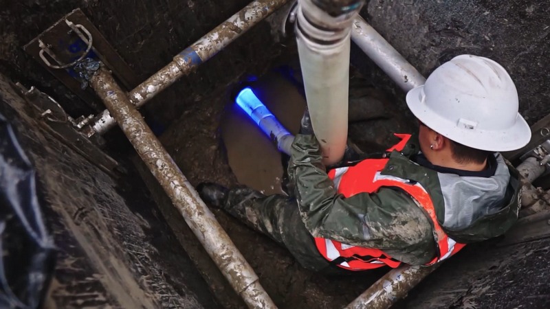Hydro jetting nozzle cleaning the inside of a sewer line.